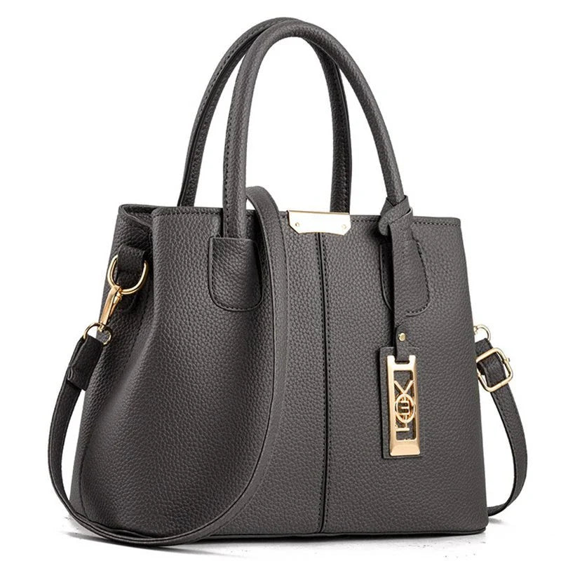 A stylish one-shoulder tote bag in various colours, made of premium polyester with an adjustable strap and spacious interior for the modern professional woman.