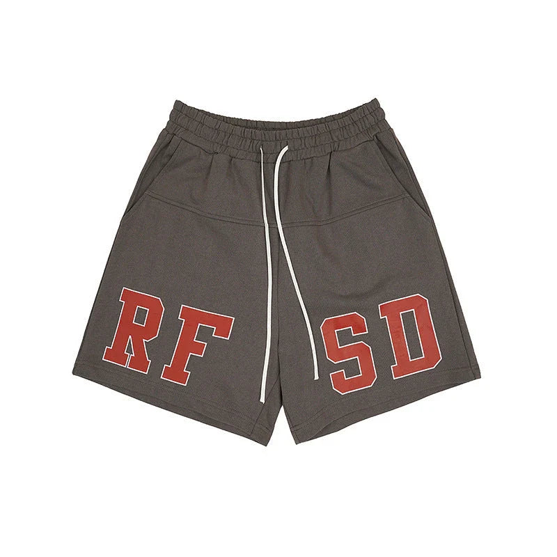 Premium loose-fit sports shorts with eye-catching printed patterns in black, khaki, and dark grey colours