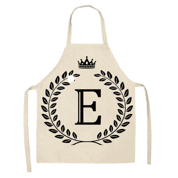 A high-quality kitchen apron featuring a charming crown and letter print design in a premium cotton and linen blend fabric.