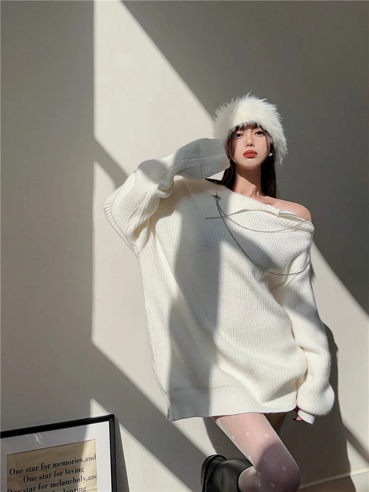 Luxurious off-the-shoulder zipper sweater in black and beige, featuring lantern sleeves and a cozy alpaca wool blend