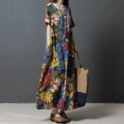 Elegant cotton and linen long dress in a classic blue hue, showcasing the high-quality natural fabrics and timeless British design.
