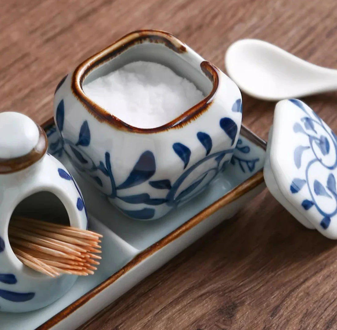 Premium four-piece ceramic seasoning set with oil, vinegar, seasoning, and toothpick holder for a stylish and organized kitchen