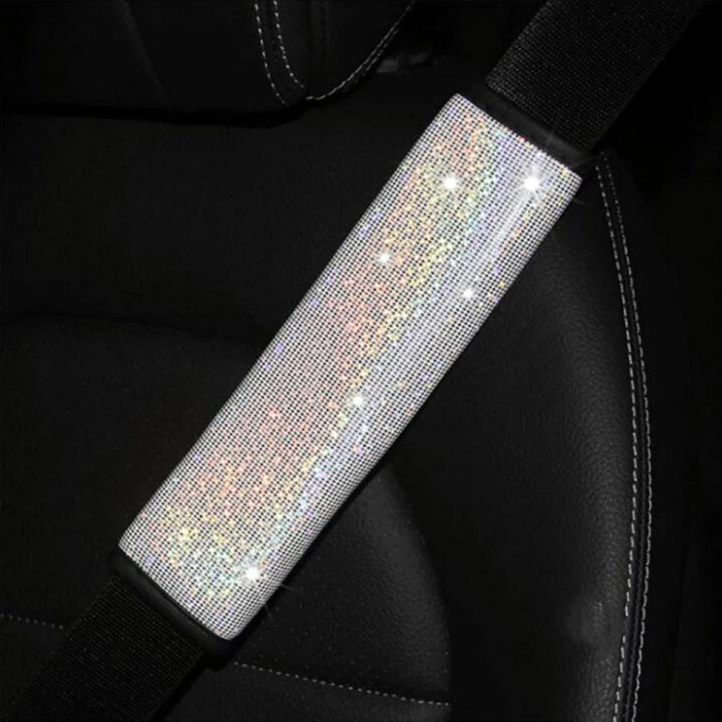 Multicoloured bling seat belt covers in a car, adding a touch of glamour and personality to the interior