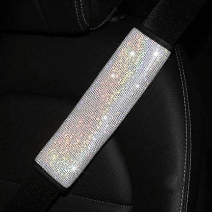 Multicoloured bling seat belt covers in a car, adding a touch of glamour and personality to the interior