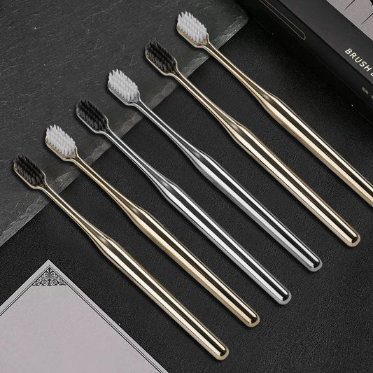 Elegant gold and silver toothbrush with soft bristles for superior dental hygiene
