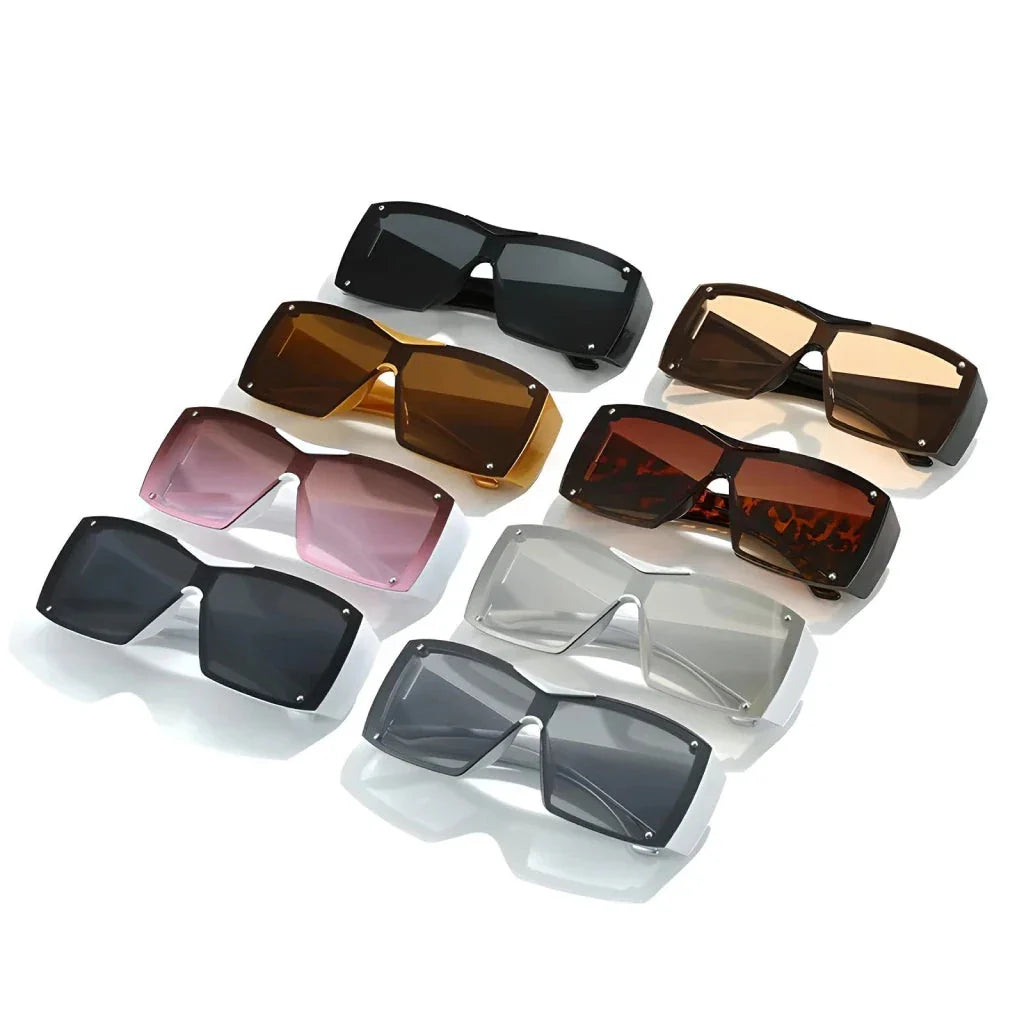 Oversized square sunglasses with black lenses and a durable plastic frame, offering UV400 protection and adaptive photochromic technology.