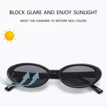 Oval-shaped women's sunglasses in a white and grey colour, offering UV protection and a stylish, retro-inspired design.