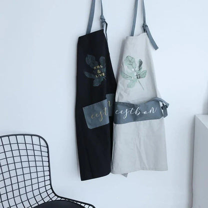 Premium cotton barista apron with a beautiful coconut leaf print design, perfect for coffee shop staff