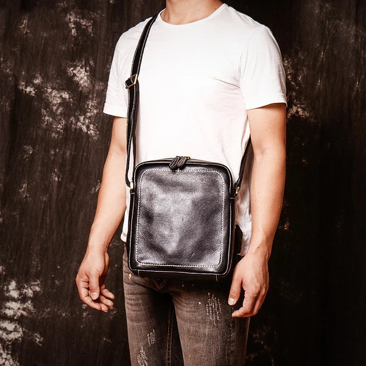 A premium cowhide leather satchel bag with a single shoulder strap, designed for the discerning British gentleman