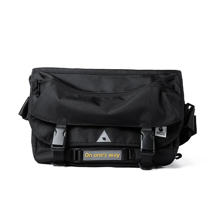 Premium casual messenger bag made with Oxford spinning material, featuring a structured yet soft exterior, ample storage space, and a water-resistant design for the modern British gentleman.