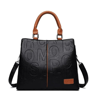 Sophisticated large leather tote bag with embossed lettering design, suitable for daily use and travel