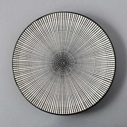 Elegant ceramic plates with vibrant, whimsical prints in a variety of enchanting designs
