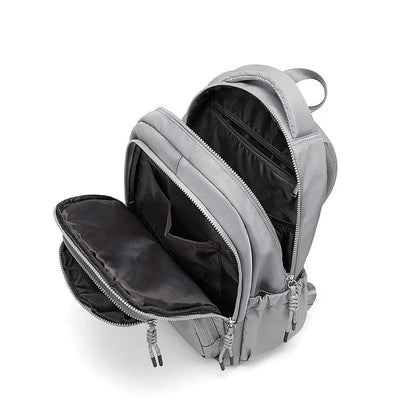 Premium leather backpack with dedicated laptop compartment, soft handles, and arcuate shoulder straps for modern women