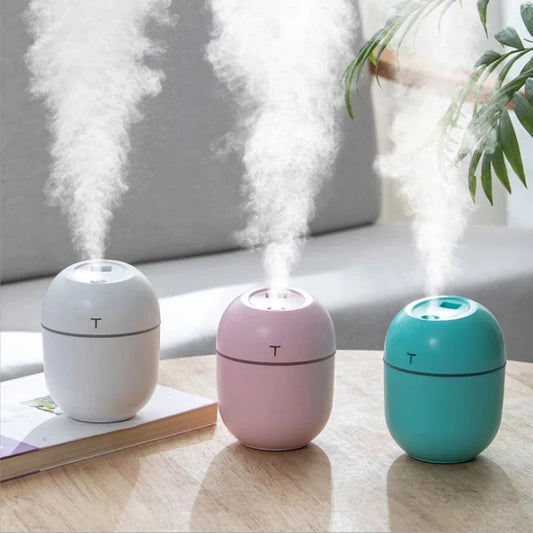 Compact ultrasonic humidifier and aroma diffuser with LED night lamp, available in white colour