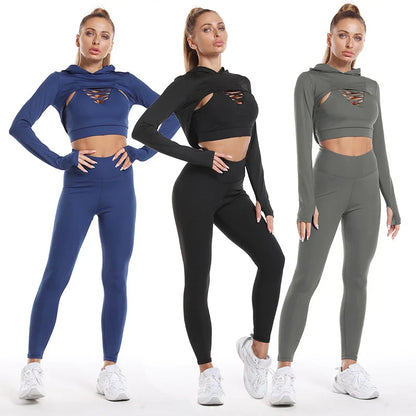 A 3-piece sports set including a hooded top, sports bra, and high-waisted leggings in a black colour scheme.