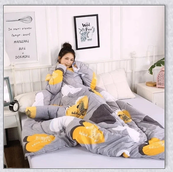 A cosy, wearable quilt with sleeves in a variety of colourful designs, perfect for staying warm and comfortable during the winter months.