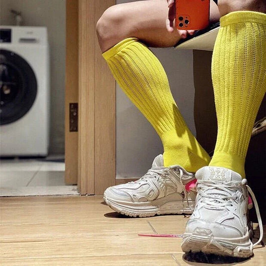 Premium men's breathable terry socks in various solid colours, offering superior moisture-wicking and comfort