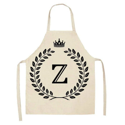 A high-quality kitchen apron featuring a charming crown and letter print design in a premium cotton and linen blend fabric.