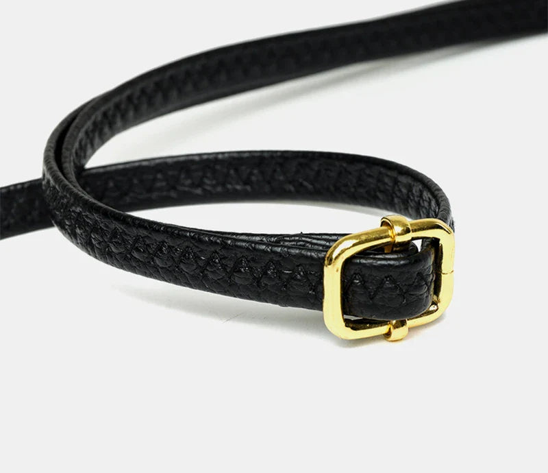 Elegant leather crossbody bag with adjustable strap, multiple pockets, and premium cowhide construction for the modern British woman