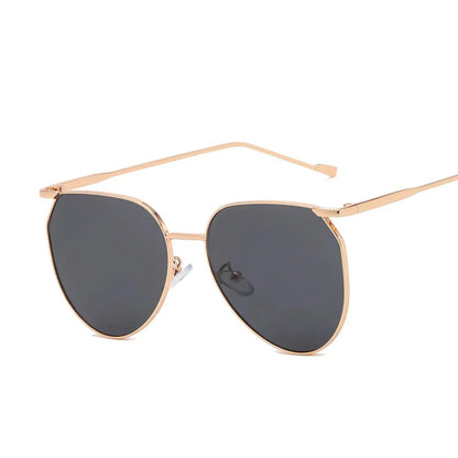 Elegant oval-shaped sunglasses with gradient lenses and alloy frames, offering timeless British style and UV protection.