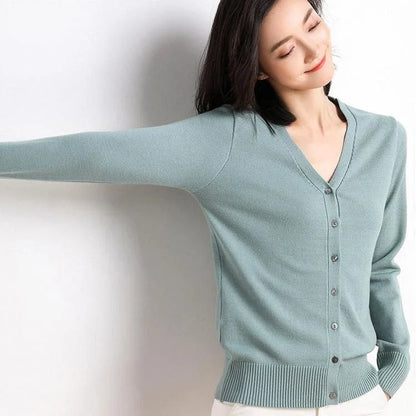Chic v-neck single breasted cardigan in blue, green, and pink colours with a sophisticated and timeless design
