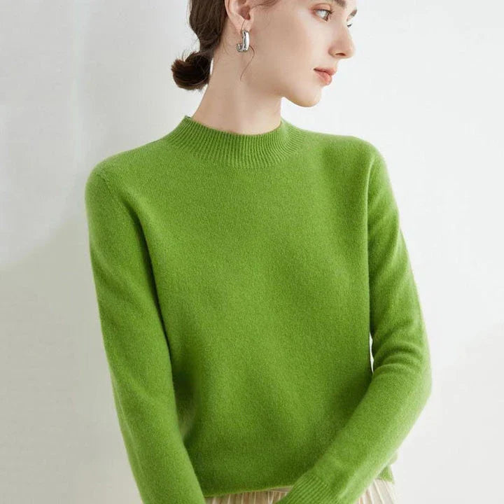 A woman wearing a luxurious Merino wool mock-neck jumper in a stylish autumnal outfit