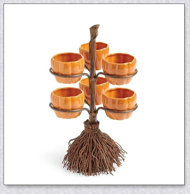 Pumpkin-shaped snack bowls on a broom-inspired stand, perfect for Halloween parties and displays