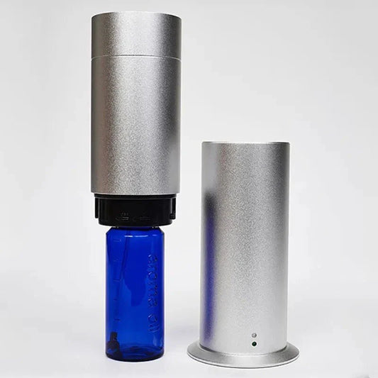 Elegant 120ml electric aroma diffuser with sleek metal design, perfect for creating a relaxing and inviting atmosphere in any setting
