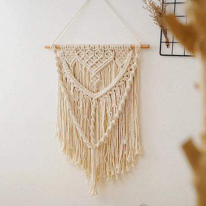 Elegant beige minimalist tapestry with unique oval shape and solid pattern, perfect for modern home decor