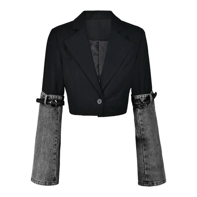 A stylish denim patchwork blazer with a notched collar and single-button closure, designed for the modern British woman