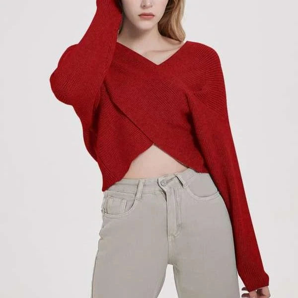 A cosy, brown V-neck knitted jumper with a relaxed, comfortable fit and a touch of vintage-inspired style.