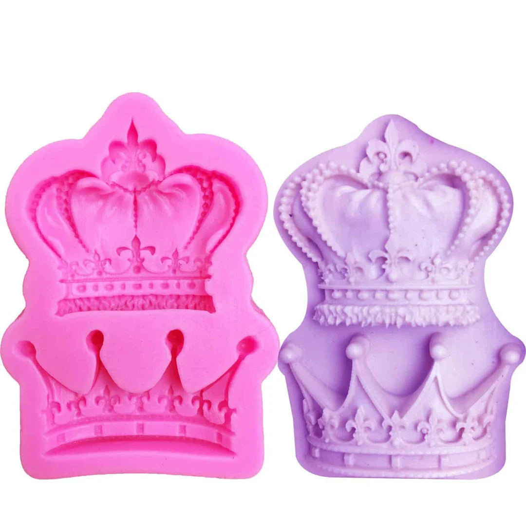 Elegant crown-shaped silicone fondant mould in vibrant pink colour for creating regal-inspired baked goods