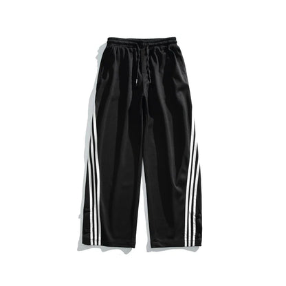 Stylish striped sports trousers in a relaxed, mid-waist design for versatile leisure and athletic wear
