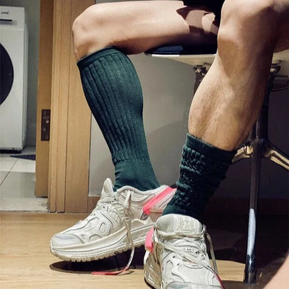 Premium men's breathable terry socks in various solid colours, offering superior moisture-wicking and comfort