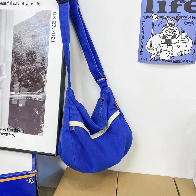 A stylish and durable canvas tote bag with a spacious interior and a timeless vintage-inspired design, perfect for everyday use and travel