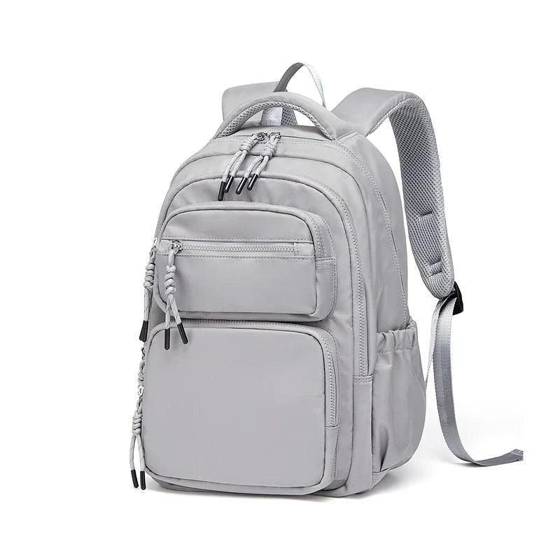 Premium leather backpack with dedicated laptop compartment, soft handles, and arcuate shoulder straps for modern women