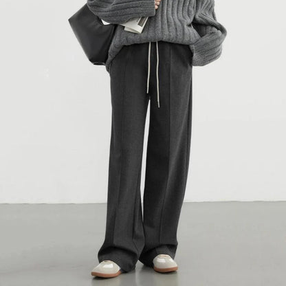 Premium high-waisted striped wide-leg trousers for stylish women, featuring a pleated front and brushed fabric for comfort