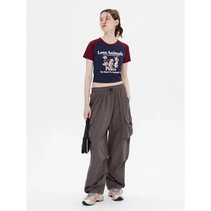 Charming Animal Print Raglan Crop Top with eye-catching graphic and contrasting sleeves
