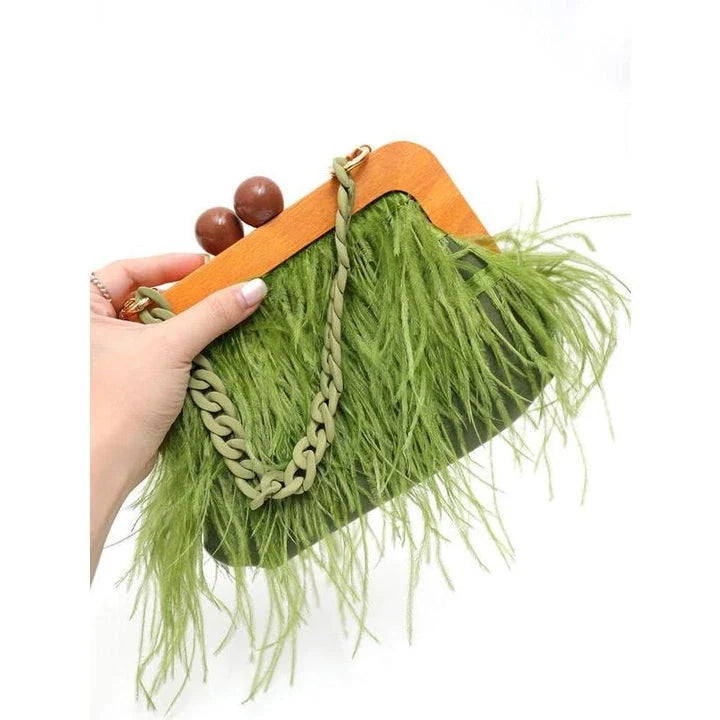 Luxury feather evening clutch with elegant acrylic chain decoration in green colour