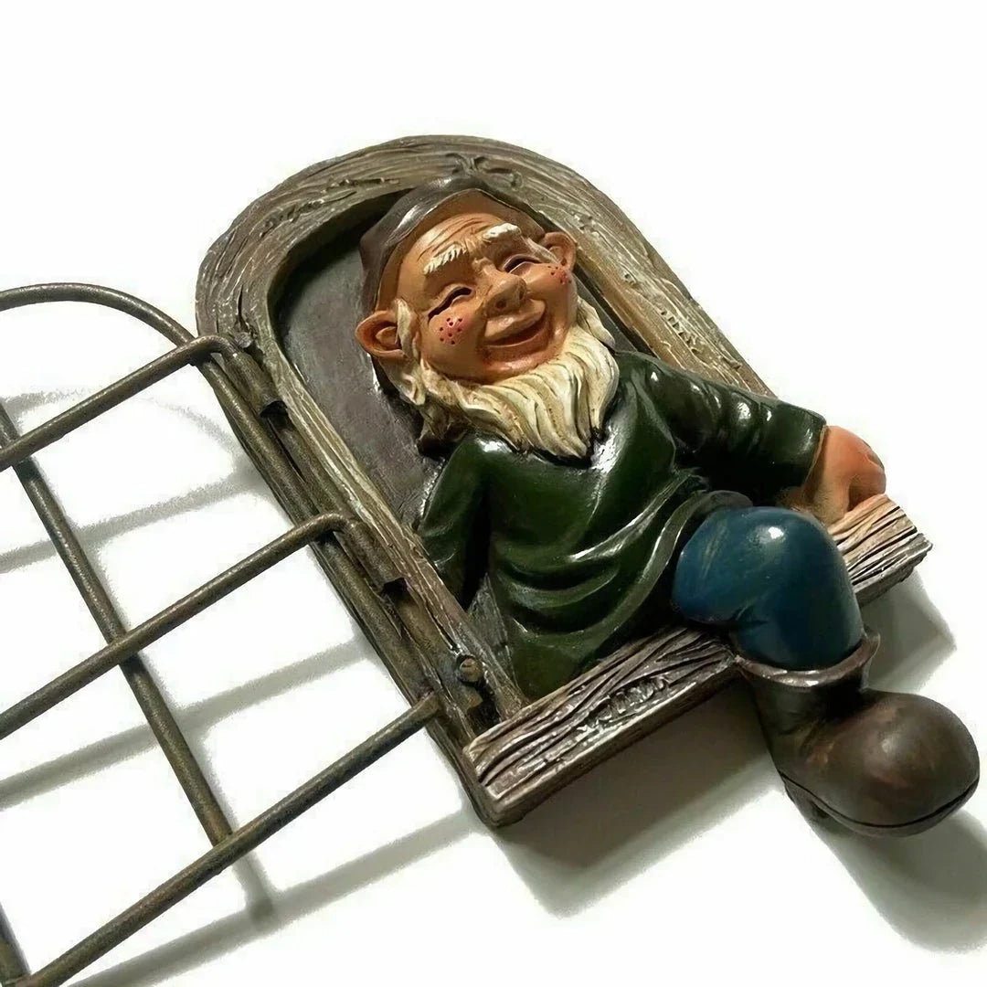 Naughty Elf Out The Door Tree Hugger Garden Statue, a charming resin gnome figure designed to hang on trees or peek out from windows and doors