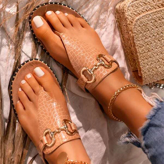 Stylish and comfortable women's leather sandals with a sleek metal buckle, perfect for summer