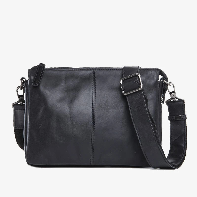 Premium cowhide leather crossbody bag with versatile internal compartments, perfect for the modern British fashionista