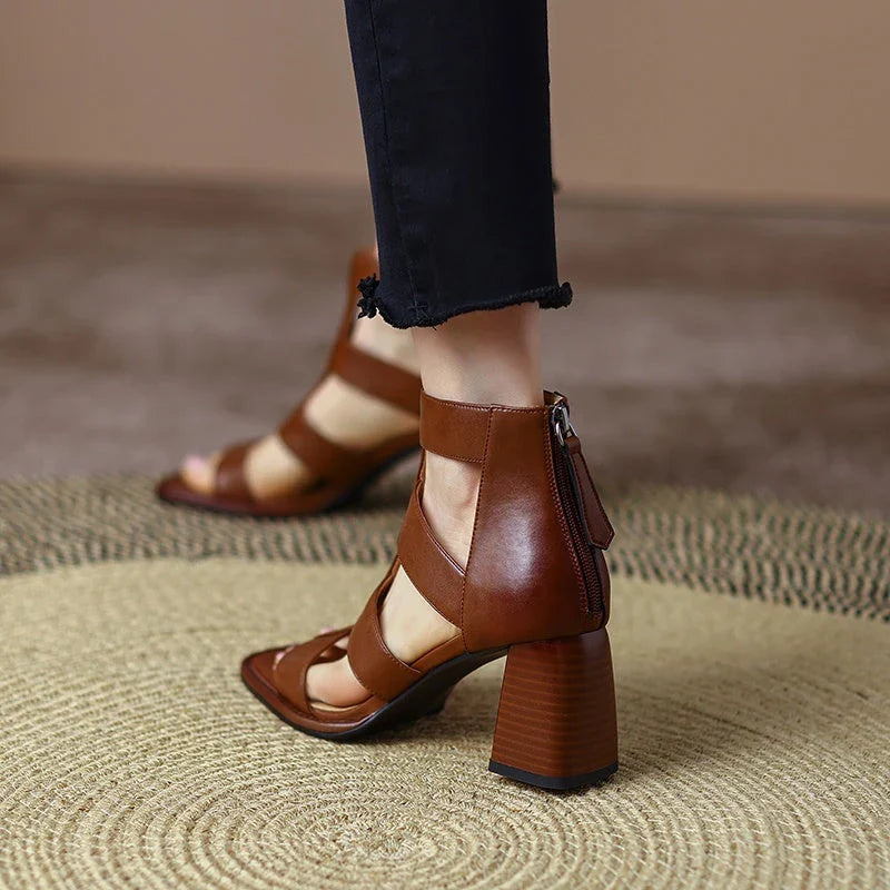 Luxurious leather gladiator sandals with square heel and buckle strap, providing style and comfort for any occasion.