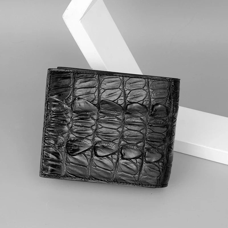 Sophisticated men's leather wallet in black, made from premium crocodile skin for a refined and durable everyday accessory