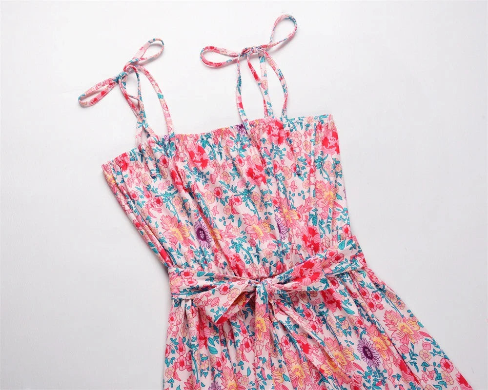 A premium printed camisole dress in a vibrant red colour, featuring a flattering mid-length skirt and high-waist design for a sophisticated, feminine look.