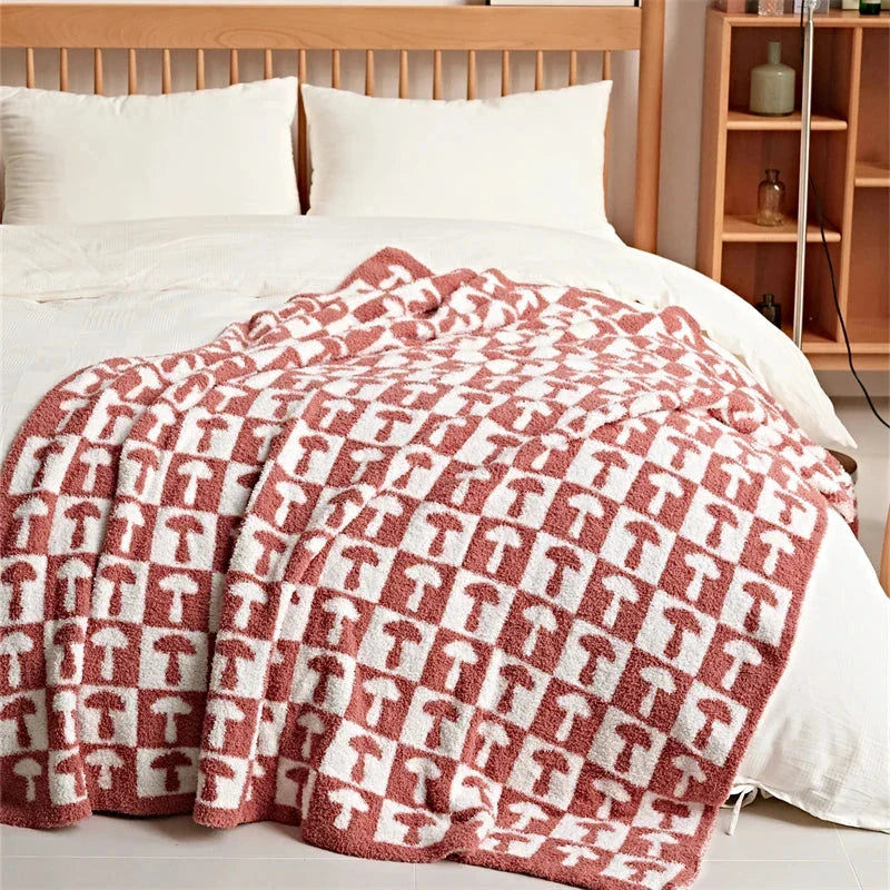 Cosy two-tone checkerboard plaid knitted throw blanket in various colours, including red, blue, grey, and purple