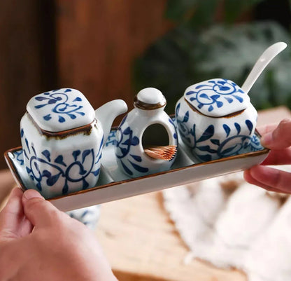 Premium four-piece ceramic seasoning set with oil, vinegar, seasoning, and toothpick holder for a stylish and organized kitchen