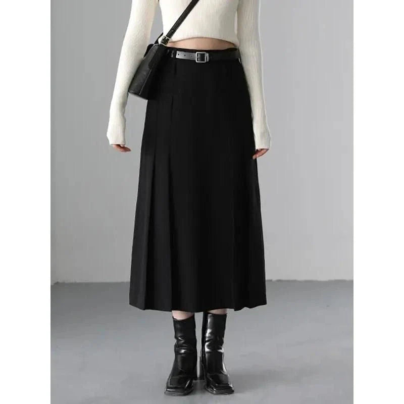 Elegant high-waisted pleated a-line skirt with a flattering silhouette and practical pockets, ideal for autumn and winter in the UK
