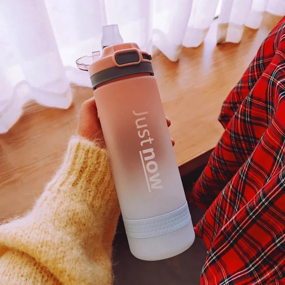 Eco-Friendly Portable Water Bottle with Straw in various colours, including Purple, Yellow, and Blue