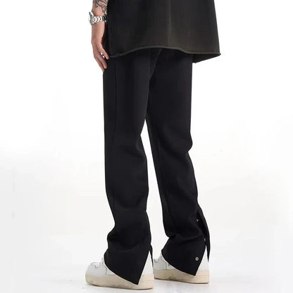 Sophisticated retro-style casual suit trousers in black and apricot colours, featuring a sleek straight-leg silhouette and distinctive back slit